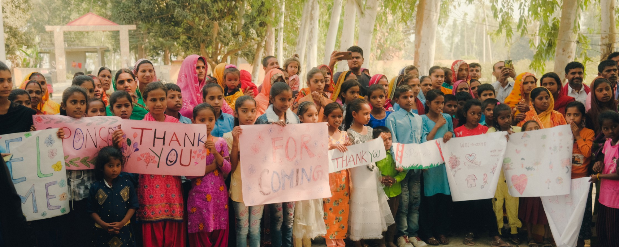 Group of children holding signs