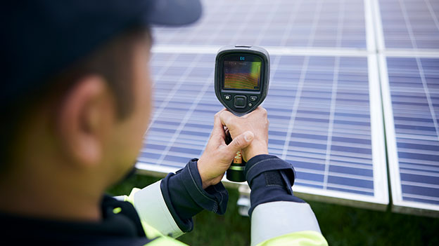 engineer checking solar panel