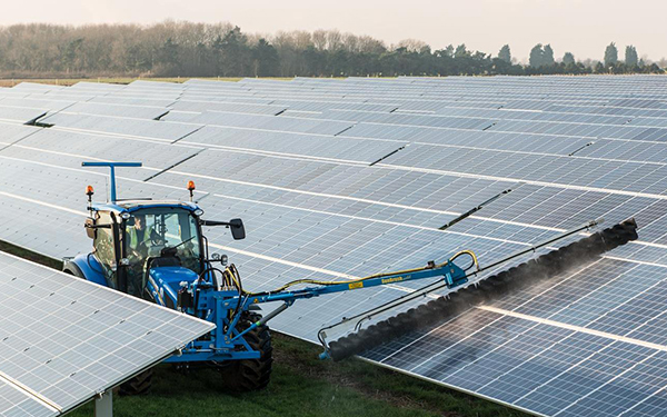 tractor cleaning solar panels