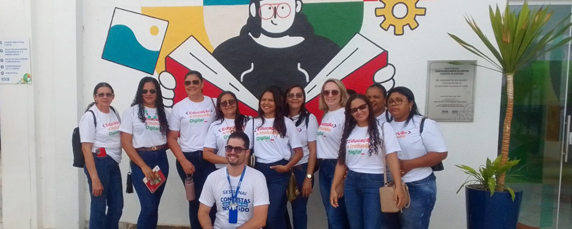 Group photo of the teachers outside the school