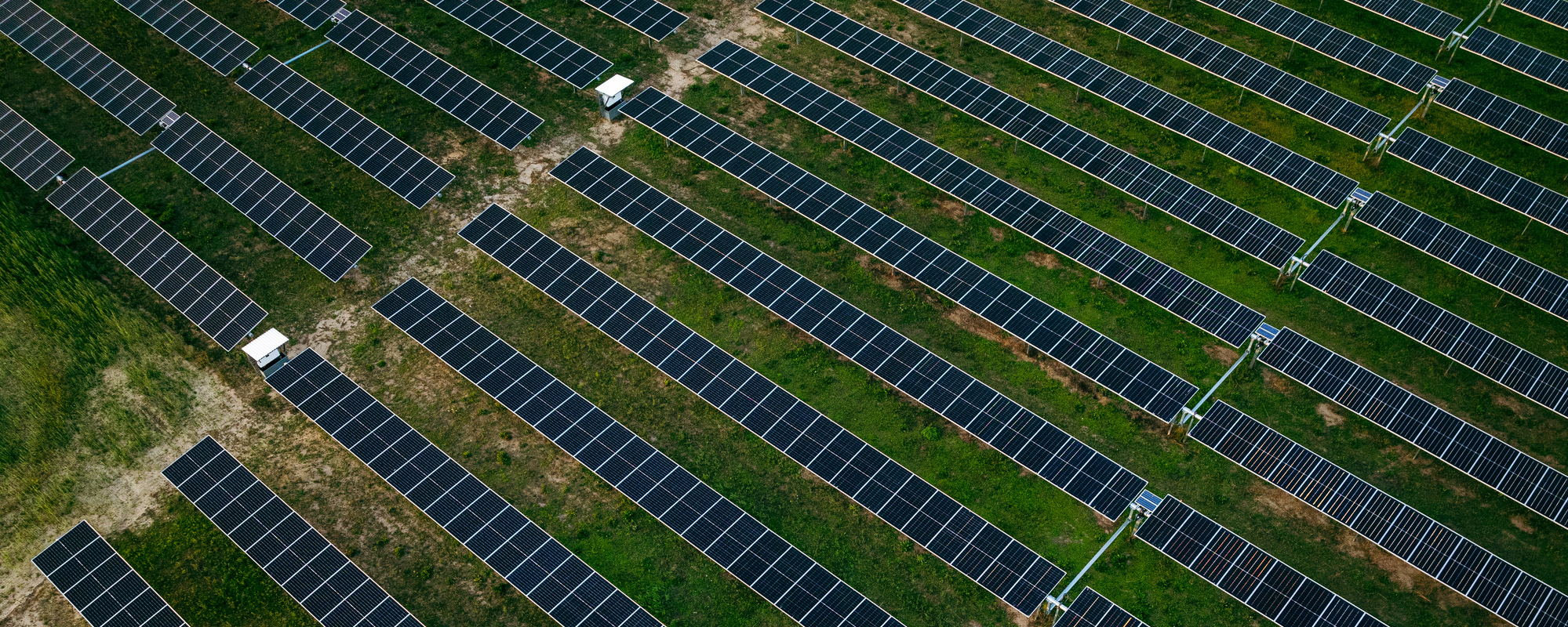 Aerial shot looking down at a field of solar panels